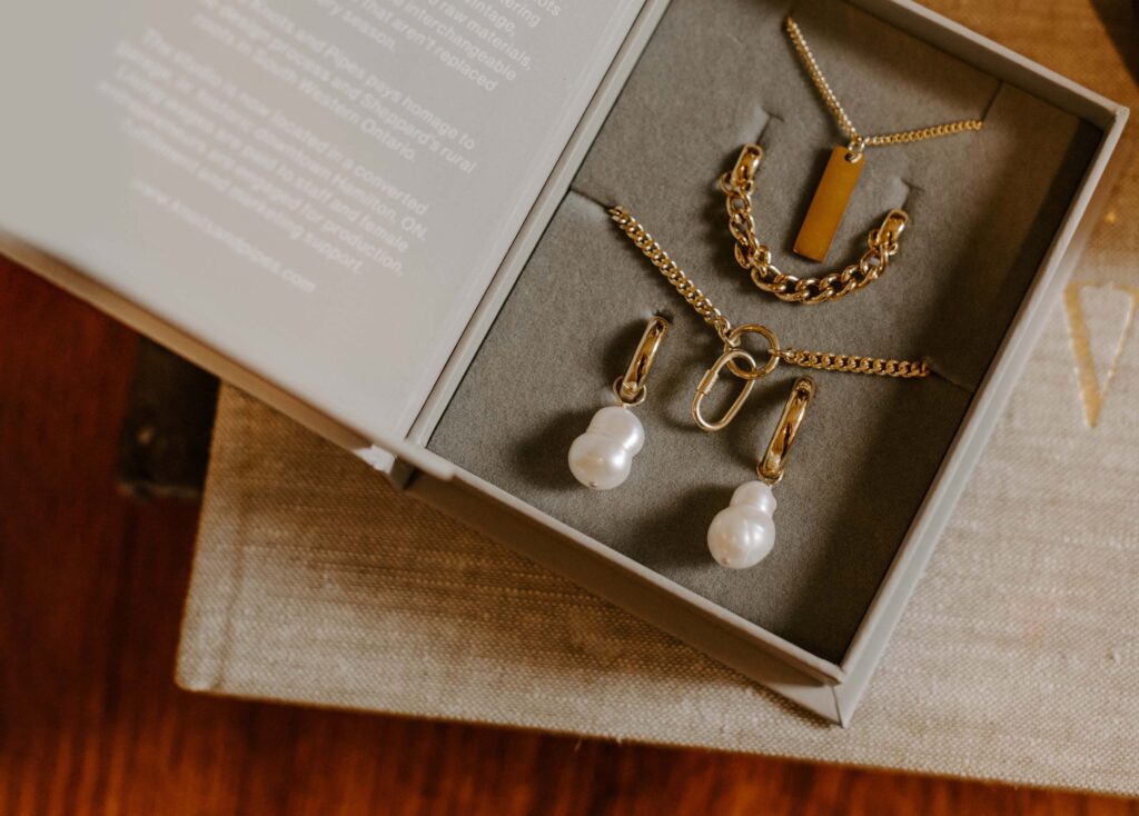 A jewelry box of gold modular jewelry set by Knots and Pipes from Hamilton Ontario